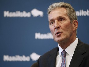 Manitoba premier Brian Pallister speaks to media after the tabling of his party's provincial budget was filibustered by the opposition NDP at the Manitoba Legislature in Winnipeg, Wednesday, March 11, 2020. Manitoba has announced that licensed daycares and preschools are being closed end of day Friday to help fight the spread of COVID-19.