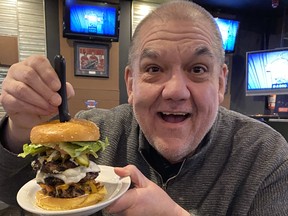 Hal Anderson with the Jumbo Jet, apparently named after defenceman Dustin Byfuglien and one of several well known challenge burgers around Winnipeg. You can find it at Boogies Diner & Sports Lounge at 1155 Main Street.