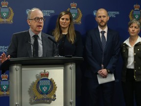 Dave Cheop (left), chairman/CEO of the Manitoba Securities Commission and CAO of the Manitoba Financial Services Agency, speaks about Fraud Cafe events along with other representatives at Winnipeg Police headquarters on Smith Street in Winnipeg on Wed., March 11, 2020. Kevin King/Winnipeg Sun/Postmedia Network