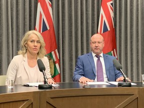 Lanette Siragusa, provincial lead, health system integration and quality/Chief Nursing Officer, Shared Health (left), and Dr. Brent Roussin, chief provincial public health officer speak to the media at the Manitoba Legislative Building in Winnipeg on Friday.