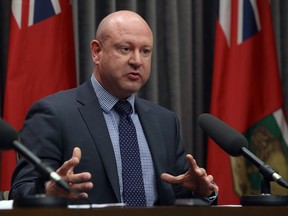 Dr. Brent Roussin, the chief provincial public health officer, gestures during a COVID-19 briefing at the Manitoba Legislative Building on Sunday.