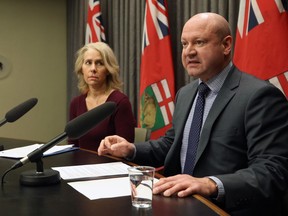 Dr. Brent Roussin (right), the chief provincial public health officer, speaks while Lanette Siragusa, chief nursing officer for Manitoba Shared Heallth looks on, during a COVID-19 briefing at the Manitoba Legislative Building on Sun., March 15, 2020. Kevin King/Winnipeg Sun/Postmedia Network