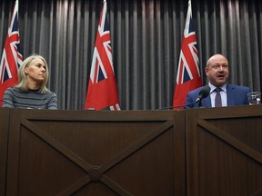 Dr. Brent Roussin, chief provincial public health officer, speaks during a COVID-19 briefing at the Manitoba Legislative Building while Lanette Siragusa, chief nursing officer for Manitoba Shared Health, listens on Mon., March 16, 2020. Kevin King/Winnipeg Sun/Postmedia Network file