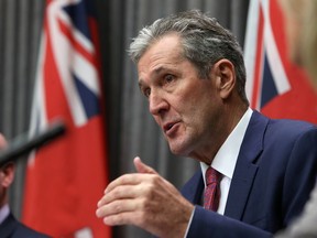 Premier Brian Pallister gestures during a COVID-19 pandemic media briefing at the Manitoba Legislative Building in mid-March.