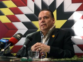 Garrison Settee, Grand Chief of Manitoba Keewatinowi Okimakanak, holds a feather during a press conference at its office on Portage Avenue in Winnipeg to discuss measures being taken by northern First Nations to combat the COVID-19 pandemic, on Wed., March 18, 2020. Kevin King/Winnipeg Sun/Postmedia Network