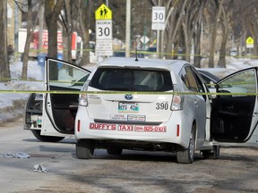 Winnipeg police at the scene of what they are calling a serious incident on Burrows Avenue between McGregor and Andrews streets in Winnipeg on Thurs., March 19, 2020. A man has been charged with second-degree murder. Kevin King/Winnipeg Sun/Postmedia Network file