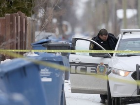 Police investigate on Thursday after a man's body was found in a trash bin in an alley in the city's North End. Chris Procaylo/Winnipeg Sun file