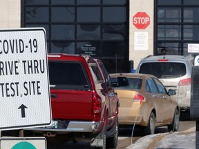 Vehicles queue at the drive-thru COVID-19 testing site on Barnes Street in south Winnipeg on Wed., March 25, 2020. Kevin King/Winnipeg Sun/Postmedia Network