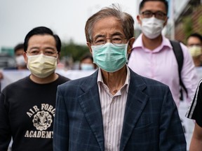 Former lawmaker and pro-democracy activist Martin Lee leaves the Central District police station in Hong Kong after being arrested on April 18. Hong Kong police arrested at least 14 pro-democracy veterans and supporters in a sweeping operation.