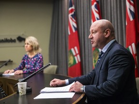 Chief public health officer Dr. Brent Roussin and Shared Health's chief nursing officer Lanette Siragusa speak during their daily media briefing at the Manitoba Legislative Building in Winnipeg on Monday. Pool photo