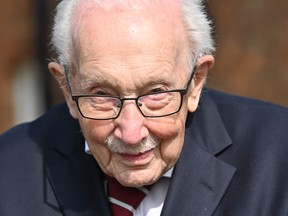 British Second World War veteran Captain Tom Moore, 99, poses doing a lap of his garden in the village of Marston Moretaine, 50 miles north of London, on April 16, 2020. (JUSTIN TALLIS/AFP via Getty Images)