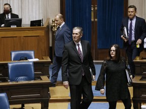 Manitoba Premier Brian Pallister enters an emergency COVID-19 physically distanced session at the Manitoba Legislature in Winnipeg, Wednesday, April 15, 2020.