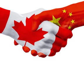 Flags Canada, China countries, handshake cooperation, partnership, friendship or sports team competition concept, isolated on white