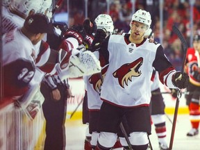 Arizona Coyotes left wing Taylor Hall celebrates with teammates after scoring a goal against the Calgary Flames during the first period at Scotiabank Saddledome.