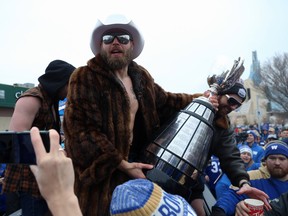 Former Blue Bombers quarterback Chris Streveler celebrates during the Grey Cup parade on Nov. 26. Streveler turned the celebrations up a notch during an Instagram Live chat set up by the team on Wednesday. (Kevin King/Winnipeg Sun)