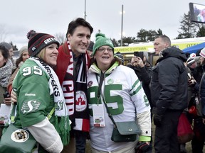 Canadian Prime Minister Justin Trudeau poses with Roughriders fans at the 105th Grey Cup in Ottawa. Nathan Denette/THE CANADIAN PRESS