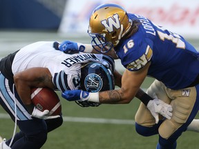 Argonauts RB Brandon Whitaker (left) is tackled by Winnipeg Blue Bombers DB Taylor Loffler. The Bombers selected Loffler 19th overall in the 2016 draft. He is a three-time league all-star.