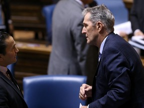 Premier Brian Pallister (right) speaks with NDP leader Wab Kinew following the throne speech before the Legislative Assembly of Manitoba on Mon., Sept. 30, 2109. Kevin King/Winnipeg Sun/Postmedia Network