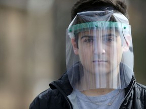 Alex Kroft (pictured) and Niels Hurst are using 3D printers to make face shields that can be used as personal protective equipment by frontline workers during the Covid-19 pandemic.  Tuesday, April 07/2020 Winnipeg Sun/Chris Procaylo/stf