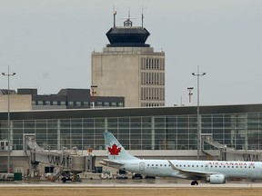 An Air Canada E190 heads for the runway for departure from Winnipeg airport for Toronto on Tuesday.