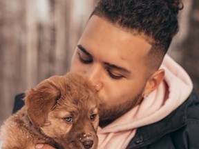 Blue Bombers' Brady Oliveira and his dog Nellie.