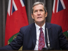Premier Brian Pallister speaks to the media about COVID-19 at a press conference at the Manitoba Legislative Building in Winnipeg on Tuesday.