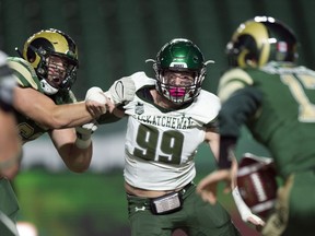 University of Saskatchewan Huskies defensive lineman Nicholas Dheilly, 99, eyes University of Regina Rams quarterback Josh Donnelly at Mosaic Stadium last season.