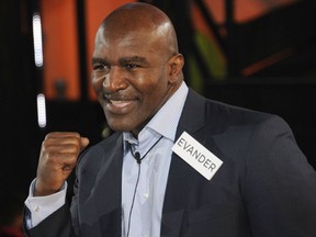 Evander Holyfield enters the Celebrity Big Brother House at Elstree Studios on January 3, 2014 in Borehamwood, England.