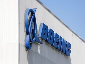 FILES) In this file photo the Boeing logo is pictured at its Renton Factory, where the Boeing 737 MAX airliners are built in Renton, Washington on April 20, 2020. - Faced with the calamitous fallout from the coronavirus on airline customers and the broader economy, Boeing found itself in an unfamiliar and uncomfortable position in March. The company, a longtime symbol of American industrial power, was unable to raise the funds to finance its business.