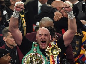British boxer Tyson Fury celebrates after defeating U.S. boxer Deontay Wilder in the seventh round during their World Boxing Council (WBC) Heavyweight Championship Title boxing match at the MGM Grand Garden Arena in Las Vegas on Feb. 22, 2020.