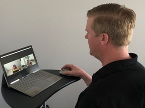 Scott Miller with NRG Athletes Therapy Fitness in Winnipeg works with a client via Telerehabilitation. NRG Athletes Therapy Fitness has been doing online physical therapy since the COVID-19 pandemic forced them to discontinue in-person sessions.