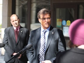 Counc. Kevin Klein (Charleswood-Tuxedo-Westwood) speaks at an announcement on Friday at City Hall for a project for exploited women in Winnipeg as Counc. Shawn Nason (Transcona) listens on. The two city councilors are proposing a new advocacy centre for marginalized women to be located at City Hall.