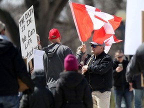 A small group of people assembled at the Manitoba Legislature and protested against measures that protect public health during the COVID-19 pandemic on Saturday.
