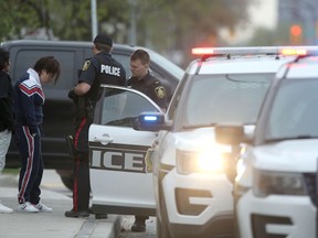 Police conduct an investigation at 747 Selkirk Avenue, in Winnipeg on Thursday May 21, 2020.