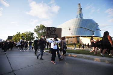 People gather in solidarity with the George Floyd protests across the United States at the Canadian Museum for Human Rights in Winnipeg, Friday, June 5, 2020.
