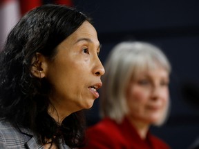 Canada's Chief Public Health Officer Dr. Theresa Tam, with Minister of Health Patty Hajdu, takes part in a news conference in Ottawa on March 9.