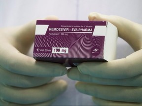 A lab technician holds the coronavirus disease treatment drug "Remdesivir" at Eva Pharma Facility in Cairo, Egypt June 25, 2020.