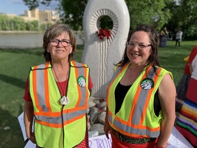 Mama Bear Clan members Jeannie Red Eagle (right) and Karen Kuwalachuck (left) at the MMIWG memorial at the Forks in Winnipeg.