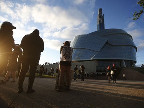 People gather in solidarity with the George Floyd protests across the United States at the Canadian Museum for Human Rights in Winnipeg, Friday, June 5, 2020. An online account that shared allegations of a racist and discriminatory work environment at the Canadian Museum for Human Rights says the resignation of the Winnipeg museum's president is just a first step.