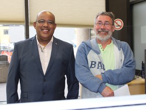 Brandon coworkers Jean Riviere (left) and David Morley (right) pick up their $1 million cheque at the Western Canada Lottery Corporation offices in Winnipeg recently after winning on the April 18 Lotto 6/49 guaranteed prize draw.