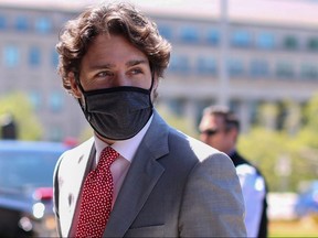In this file photo, Prime Minister Justin Trudeau arrives on Parliament Hill to attend a sitting of the Special Committee on the COVID-19 pandemic, May 20, 2020 in Ottawa.