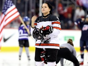 Canada defence Brigette Lacquette looks on during the anthems prior to a pre-Olympic series exhibition game against the United States in Winnipeg on Tues., Dec. 5, 2017. Kevin King/Winnipeg Sun/Postmedia Network