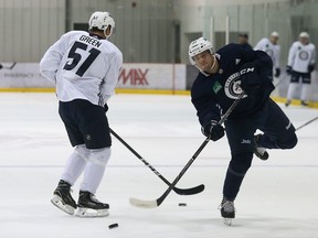 Cole Maier (right) shoots during Winnipeg Jets development camp at Bell MTS Iceplex on Thurs., June 28, 2018.