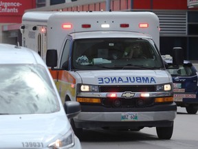 A paramedic drives an ambulance on William Street in Winnipeg on Tues., June 2, 2020.