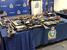 Winnipeg Police show off a cache of seized firearms at a press conference at Winnipeg Police headquarters on Tuesday, June 9. 2020. Winnipeg Police announced a large seizure of firearms in two separate investigations including an AR-15 lower end receiver and a Glock 19 handgun lower receiver which had been manufactured out of plastic using a 3-D printer. The manufactured firearms are referred to as 'ghost guns' as they have no serial number.