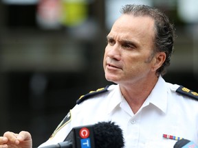 Police chief Danny Smyth meets with media following a Winnipeg Police Board meeting in city council chambers in Winnipeg on Monday.