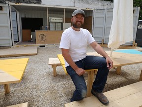 Co-founder Brad Chute poses for a photo at the Beer Can, a pop-up beer garden between two historic buildings, on Main Street in Winnipeg on Thurs., June 11, 2020. Kevin King/Winnipeg Sun/Postmedia Network