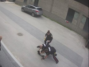 Winnipeg police are defending their actions on Friday, after a video surfaced on social media showing officers kneeing and kicking a man during an arrest after a video circulated on social media of a man being arrested after an incident in the Exchange District. A screenshot from the video is shown.