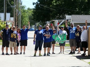 Bombers fans, including organizer Daryl Budnick (far right in white), take part in a virtual tailgate party on Saturday,