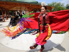 A dancer from Walking Wolf performs during a Folklorama at Home booking at River Park Gardens long-term care home on St. Anne's Road in Winnipeg on Tuesday.